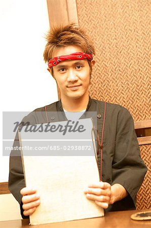 Young man holding menu