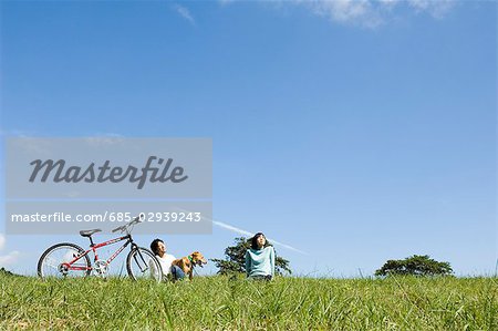 Young couple playing with dog