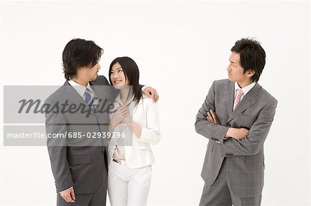 Businessman looking at couple
