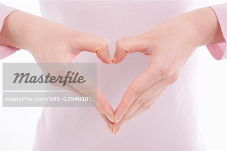 Woman making heart shape with her hands