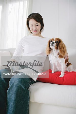 Young woman and cavalier king Charles spaniel