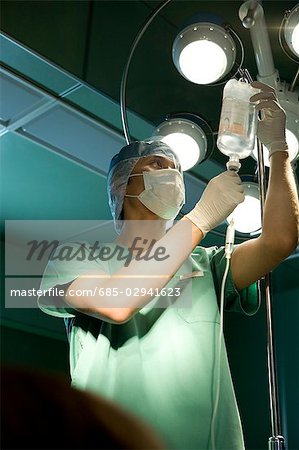 Nurse preparing IV drip