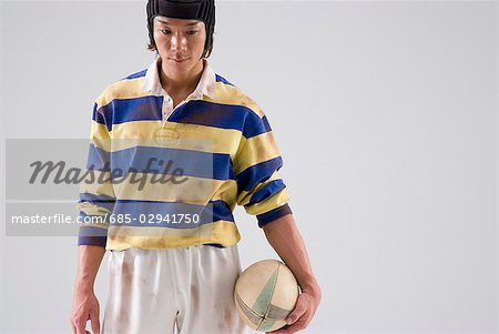 Rugby player holding ball