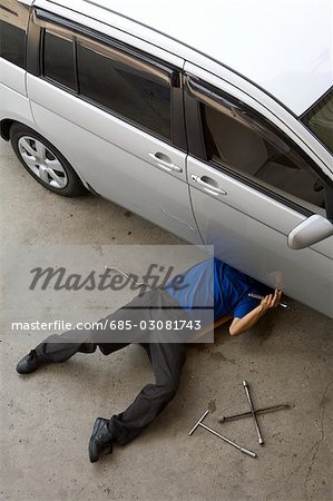 Gas station clerk maintaining car