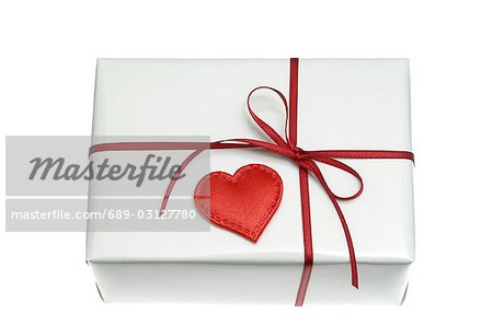White wrapped gift with a red heart