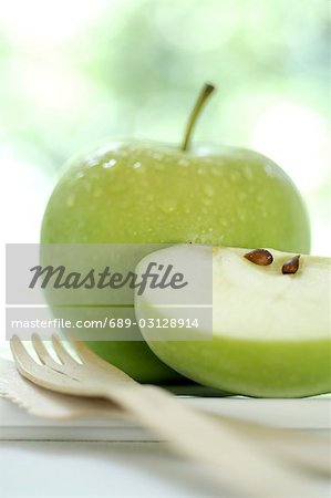 Apple and a wooden fork