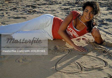 Drawing a heart in the sand