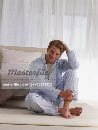 young man in blue pyjamas