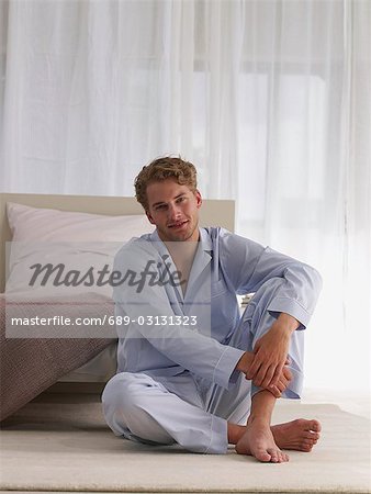 young man in blue pyjamas
