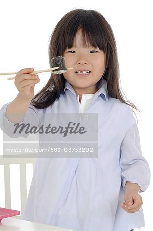 Girl eating sushi