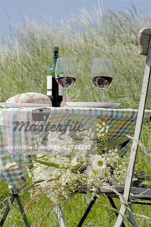 Bread and wine on table outdoors
