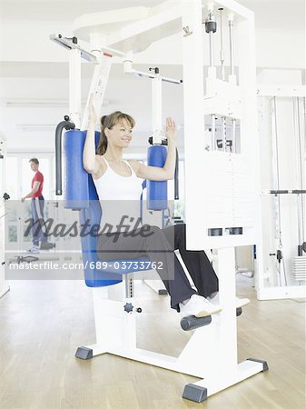 Woman exercising at a health club