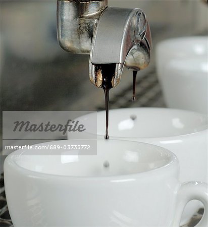 Espresso flowing into cup