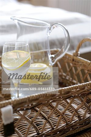 Carafe and glass of water with slice of lemon