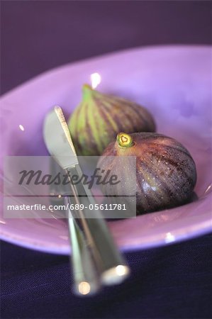 Two figs on a plate