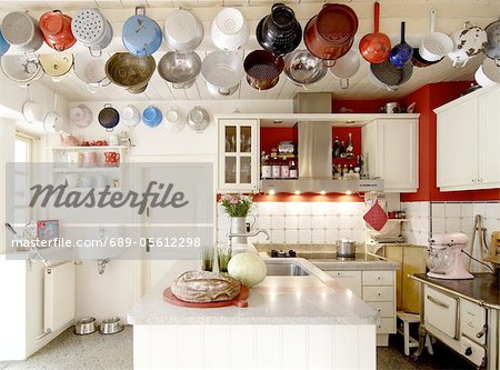 Country kitchen with sifters on the ceiling