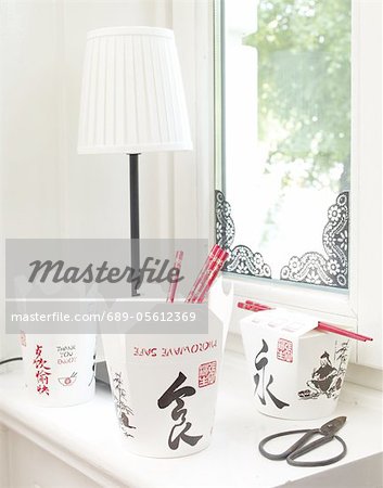 Asian take away food boxes on windowsill Asian take away food boxes on windowsill