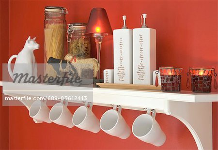 Kitchen shelf with cups and decorative objects