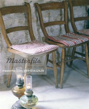 Wooden chairs and gas lamps