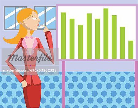 A woman standing beside a data board