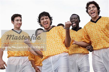 Cheering soccer team, portrait, low angle view