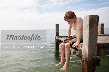 Teen boy with water, Stock image