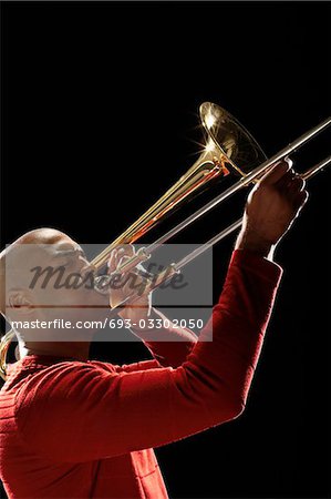 Man Playing Trombone, close-up, side view