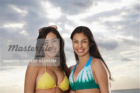 Two teenage girls (16-17) in bikini, portrait