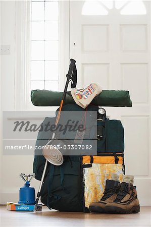 Backpack and camping equipment in hallway