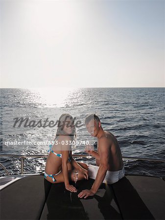 Couple Sunbathing on Boat