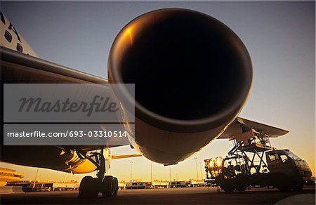 Close-up on jet engine at sunset
