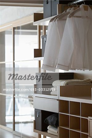 Linen on shelves in contemporary furniture store bedroom