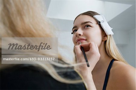 Model Having Makeup Applied