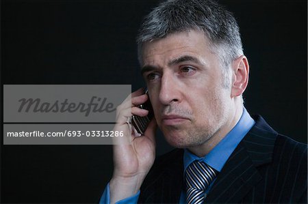 Worried Businessman on the Telephone