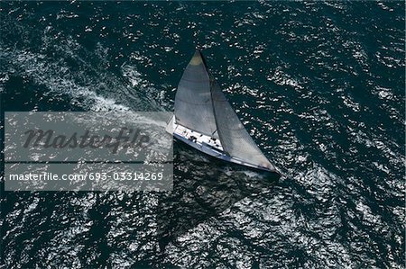 Yacht competes in team sailing event, California, aerial view