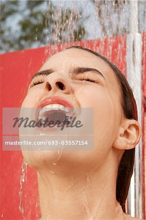 Woman Using Outdoor Shower, head shot, close up