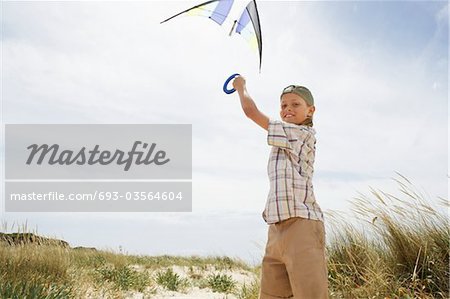 Girl Flying Kite at Sand Dunes