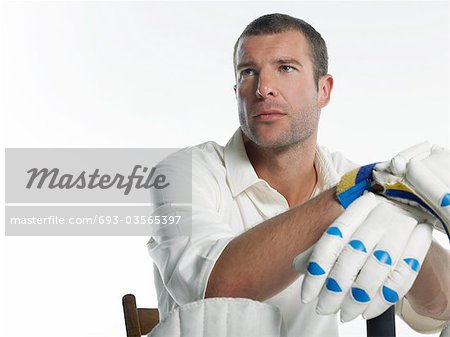 Cricket player, sitting in chair, low angle view