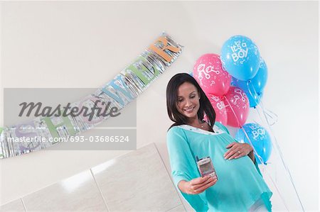 Pregnant Woman with Her New Baby Monitor at baby shower