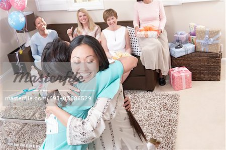 Woman hugging at baby shower