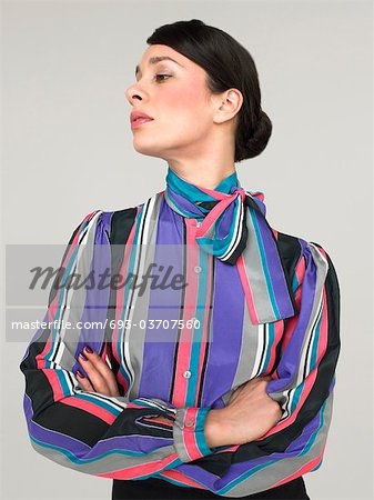 Business woman with arms crossed  in Studio