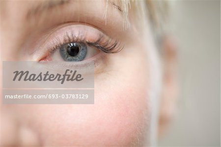 Part of a young womans face showing her eye