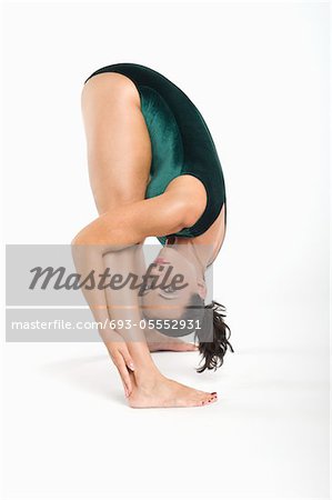 Portrait of mid adult woman bending down