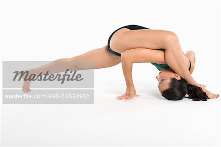 Woman exercising over white background