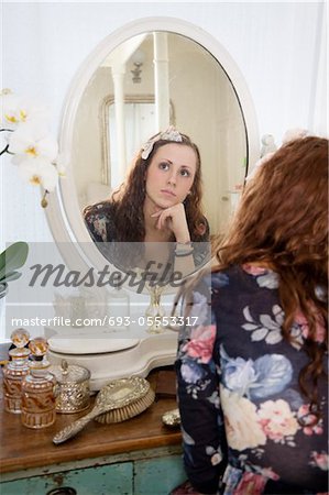 Premium Photo  Pensive woman sitting at table while thinking