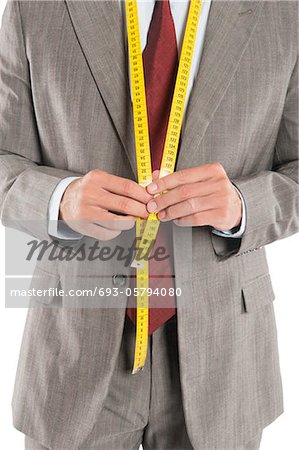 Man wearing a tape measure across his suit
