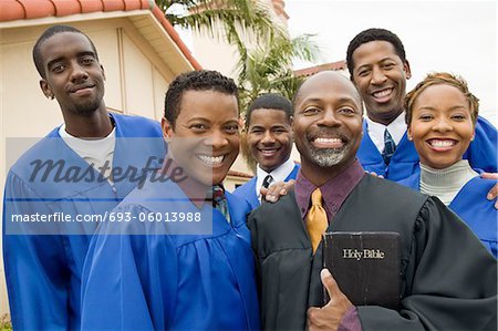 Preacher and Choir in church garden, portrait