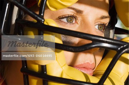 Softball player wearing helmet, close-up of face