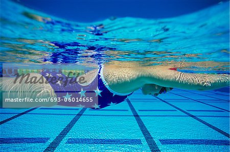 Female swimmer underwater in pool