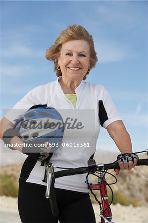 Woman with bicycle and helmet, portrait